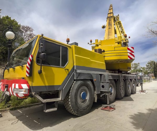 Mobile crane at construction site heavy truck big